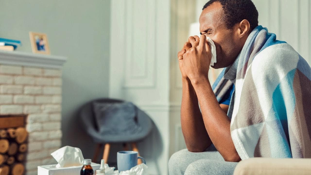 A man being sick at home