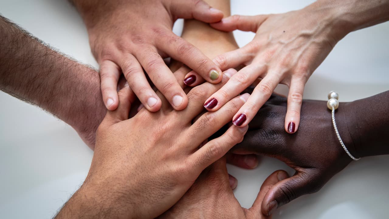 Hands of people of different colour